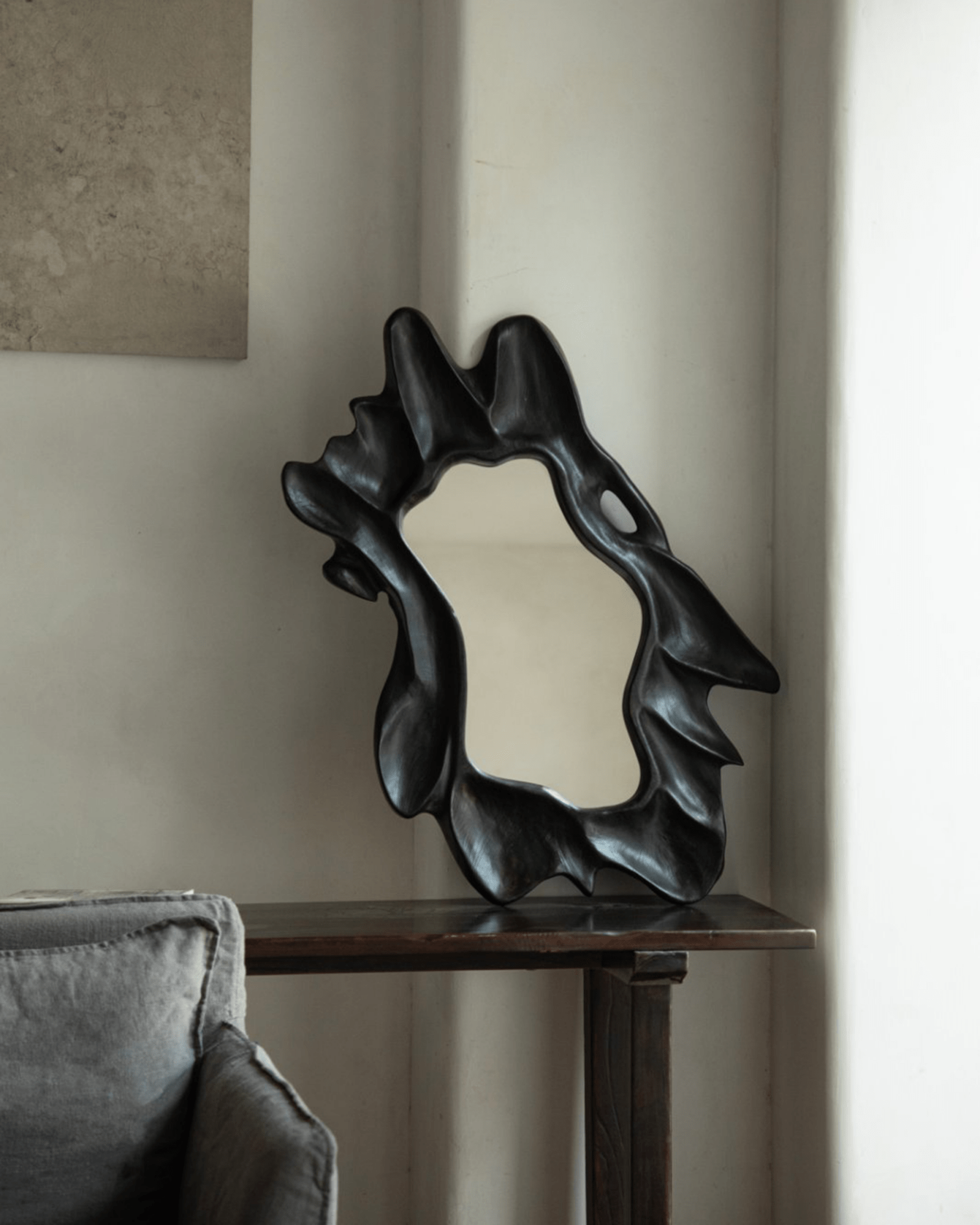 Organic Wood Arbor Mirror in dark finish, handcrafted natural shape for modern interior decor.