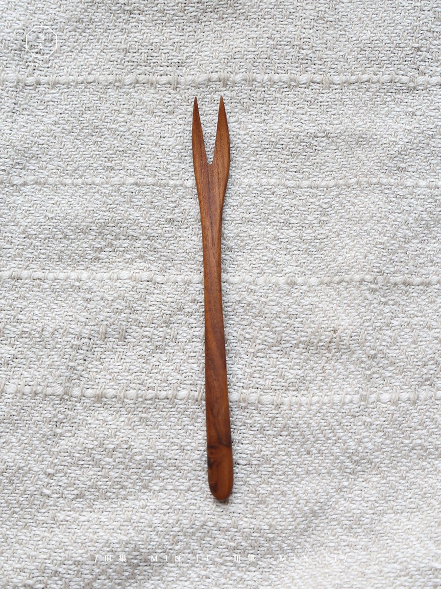 Elegant wooden fork, natural wood grain. MIN JI design, perfect for appetizers. Eco-friendly cutlery.