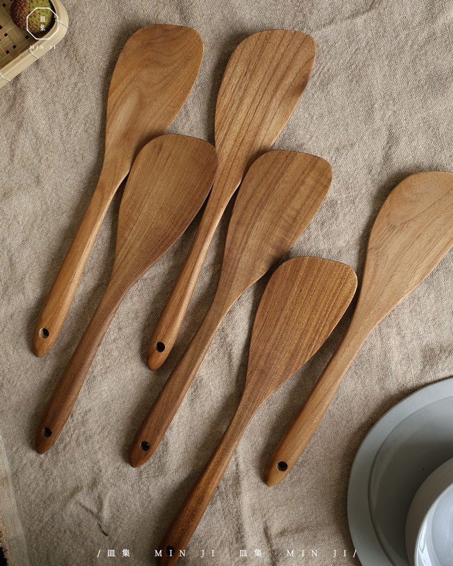 Fried Spatula made of natural teak wood, smooth finish, kitchen utensil.