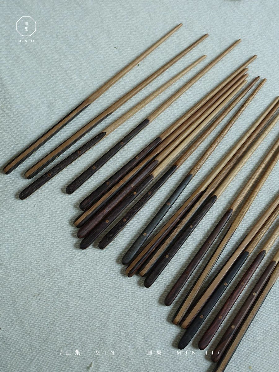MIN JI wooden chopsticks set, natural wood color with dark wood accents, ideal for Asian cuisine.