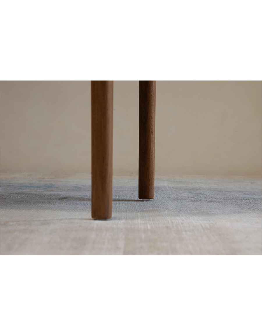 Hans Accent Table: Close-up of wooden table legs, showcasing the natural wood grain and minimalist design.