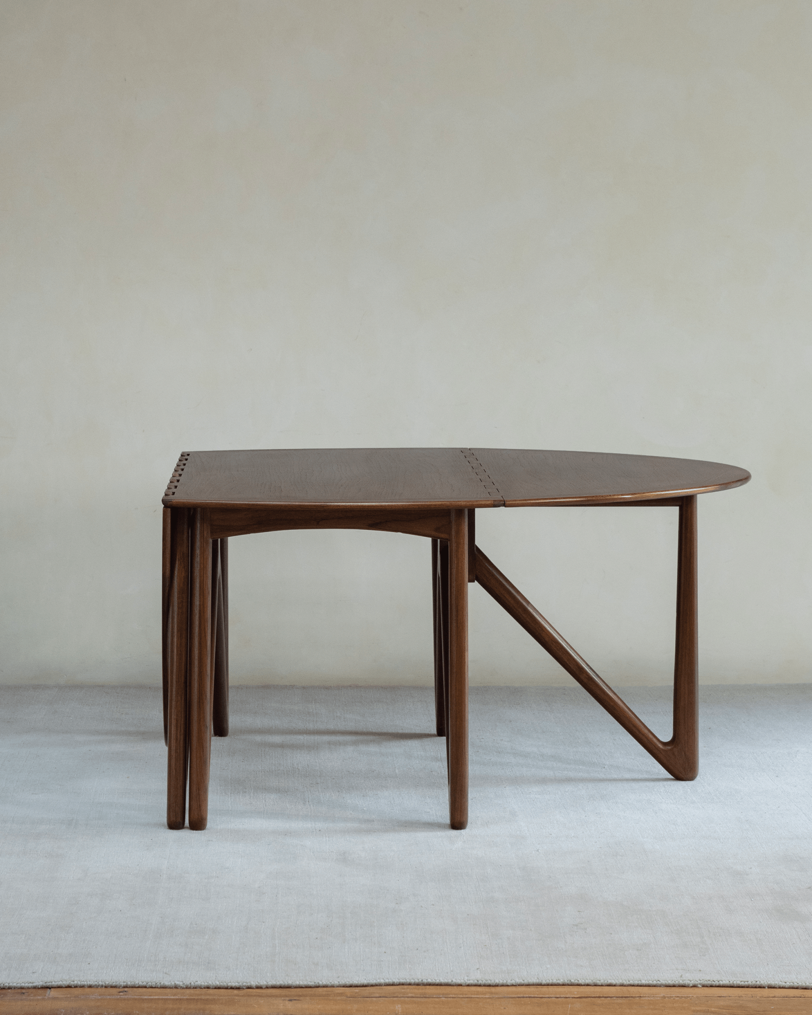 Niels Folding Table, teak wood, extended oval, V-shaped legs, mid-century modern design