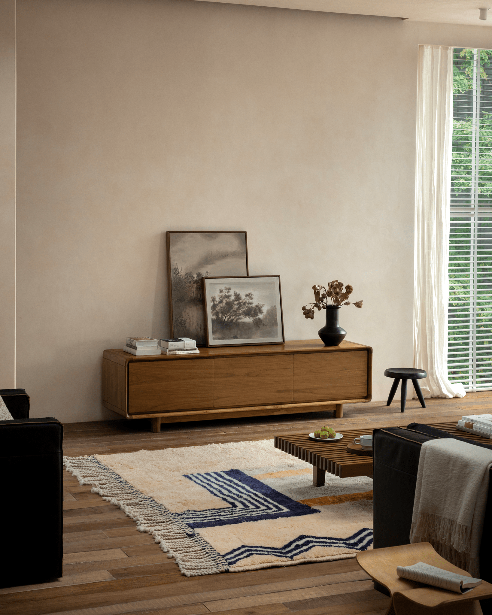 NO.34 Media Console in a modern living room setting, featuring wooden cabinet, artwork, and decor.