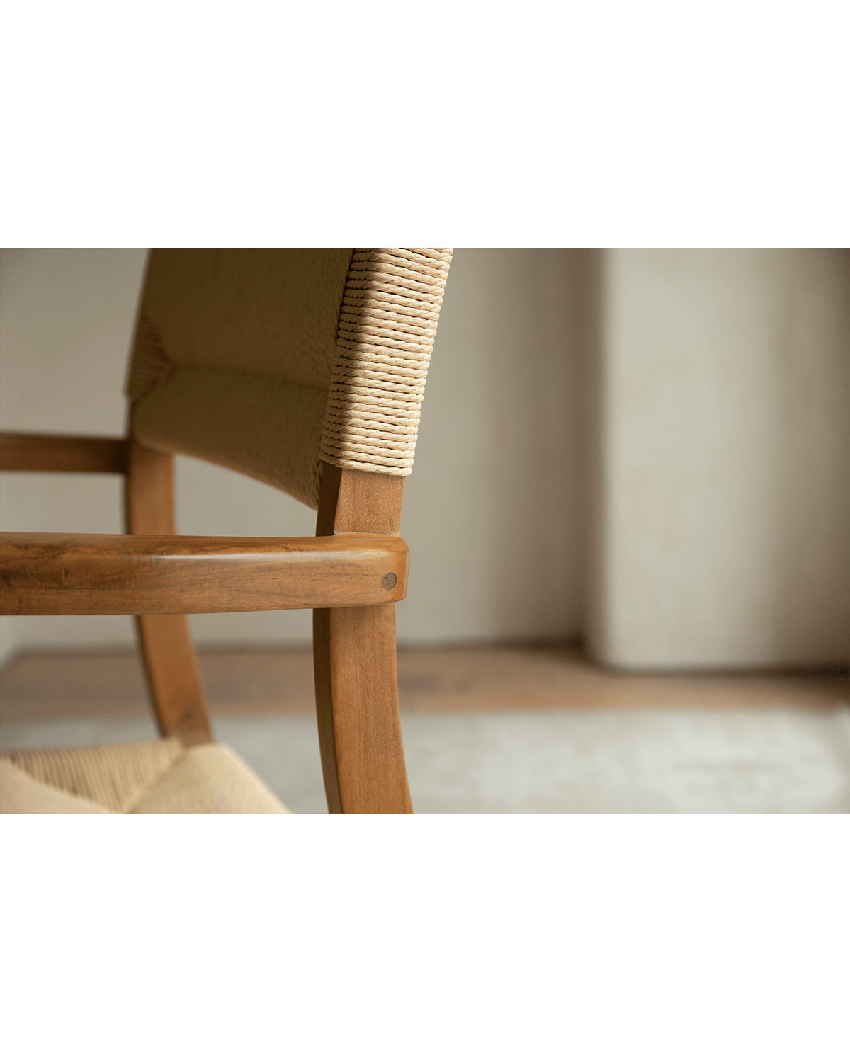 Reed Chair detail: Teak frame with woven backrest and seat, elegant design for dining and living spaces.