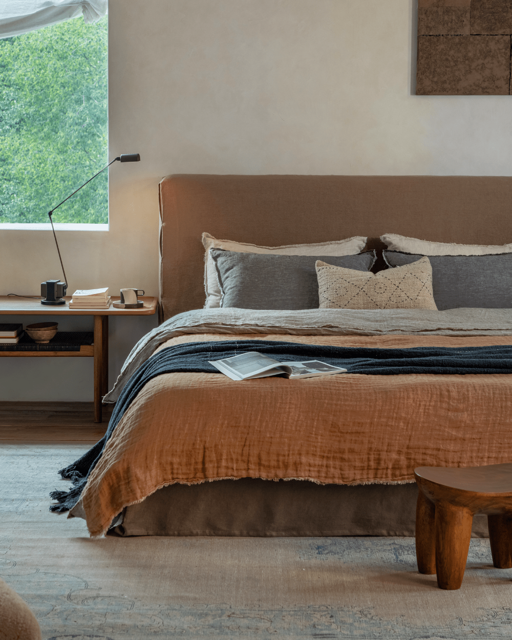 Freya Linen Bed with terracotta linen bedding and headboard in a modern, cozy bedroom setting