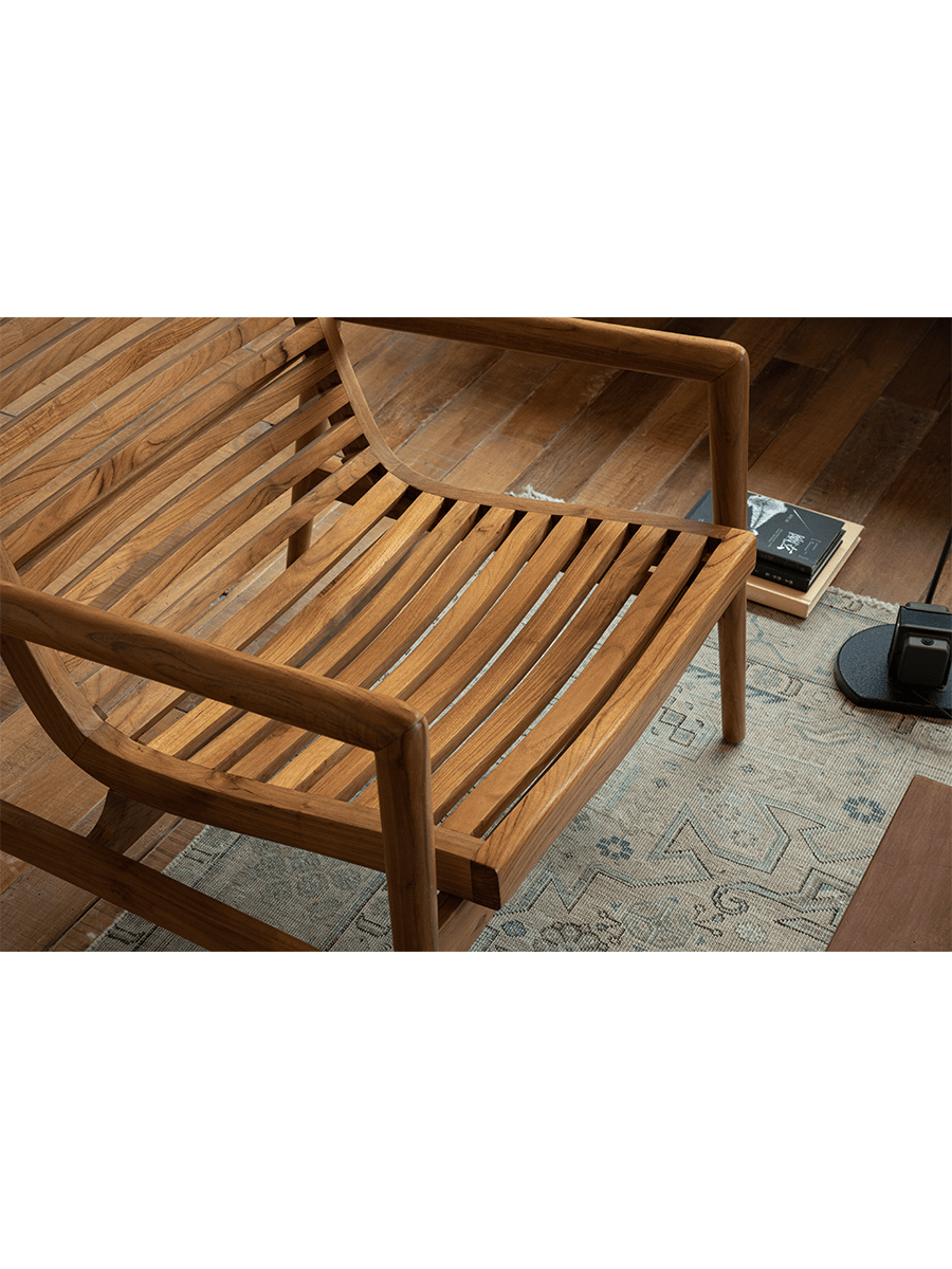 Teak wood garden lounge chair with slatted back and armrests, modern design, indoor comfort
