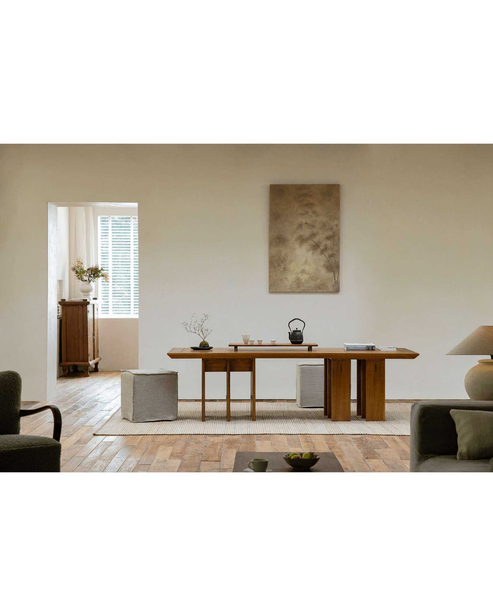Titan Teak Dining Table in a modern setting with tea set, multi-leg design, natural light, and matching chairs.