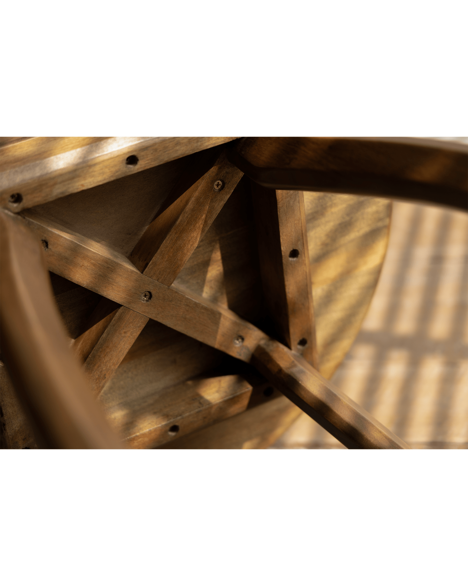 Close-up of Ele Round Side Table's Phoebe wood base, showcasing the intricate wooden structure and vintage finish.