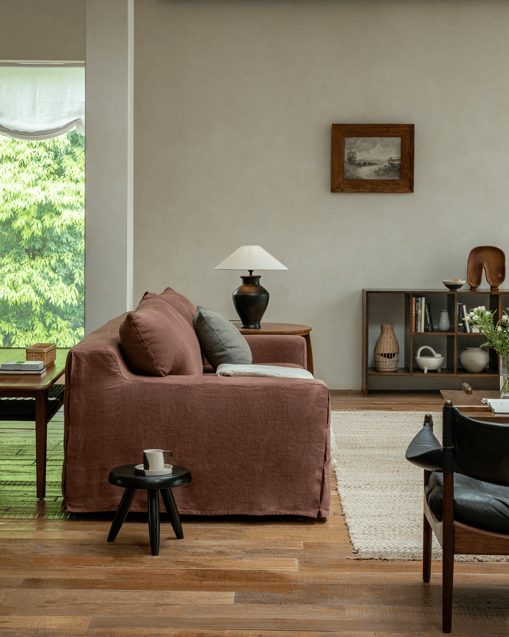 Terracotta Guni Linen Sofa in a cozy living room setting, showcasing linen fabric, wooden furniture, and natural textures