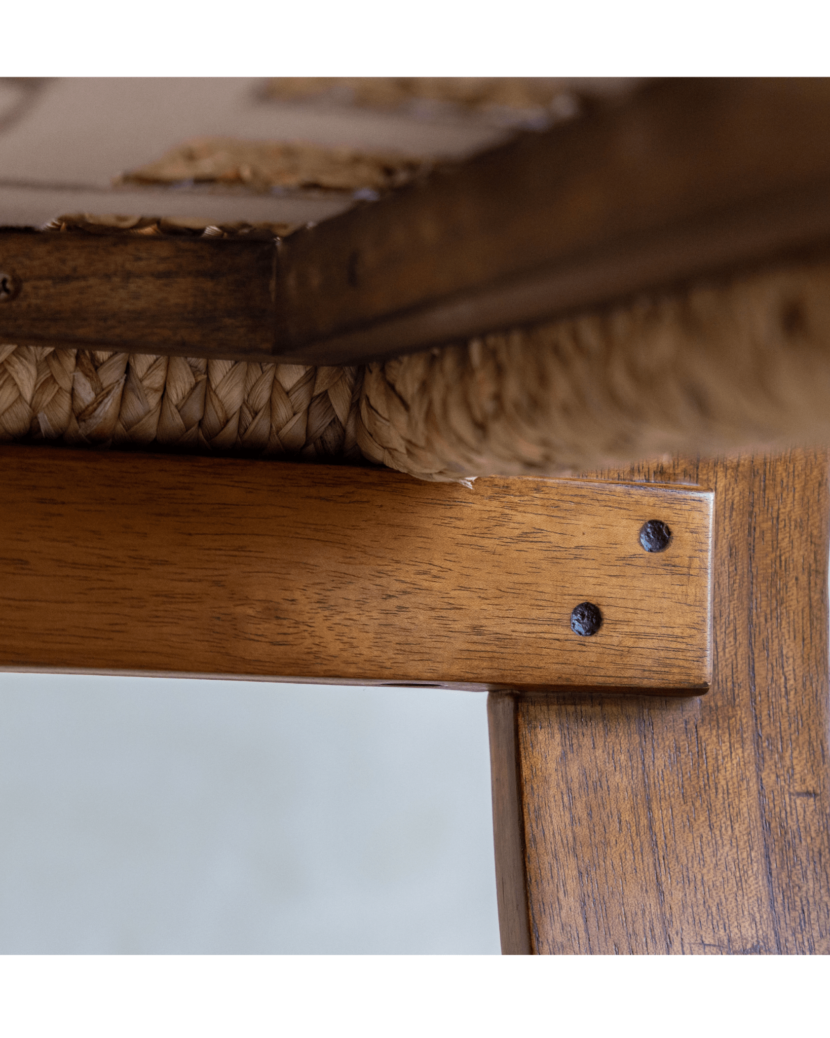 C Curve Lounge Chair detail: bentwood frame with woven grass rope seat and wooden joint, mid-century modern