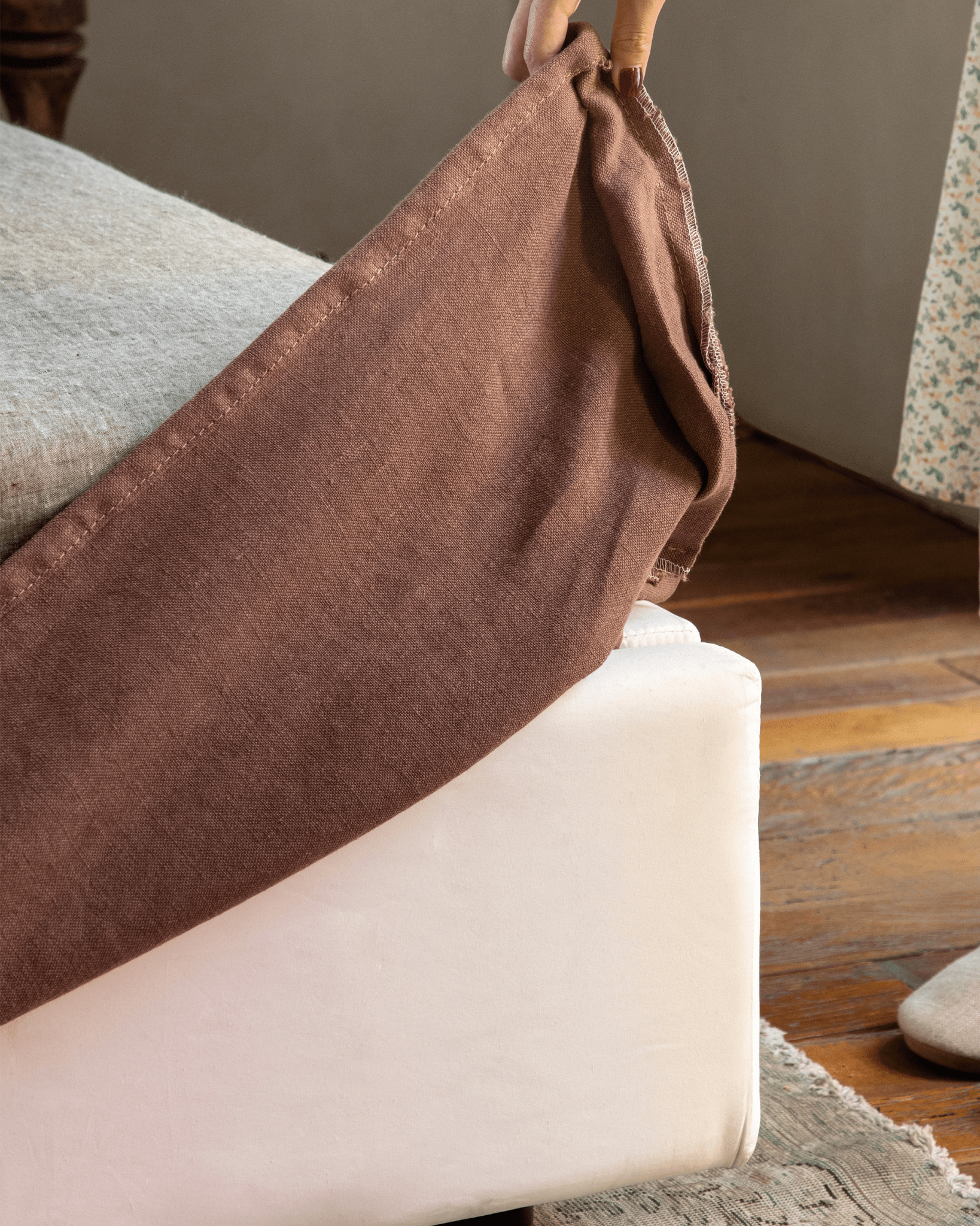 Freya Linen Bed detail: Terracotta linen bed cover, linen upholstery, for a peaceful sleep.