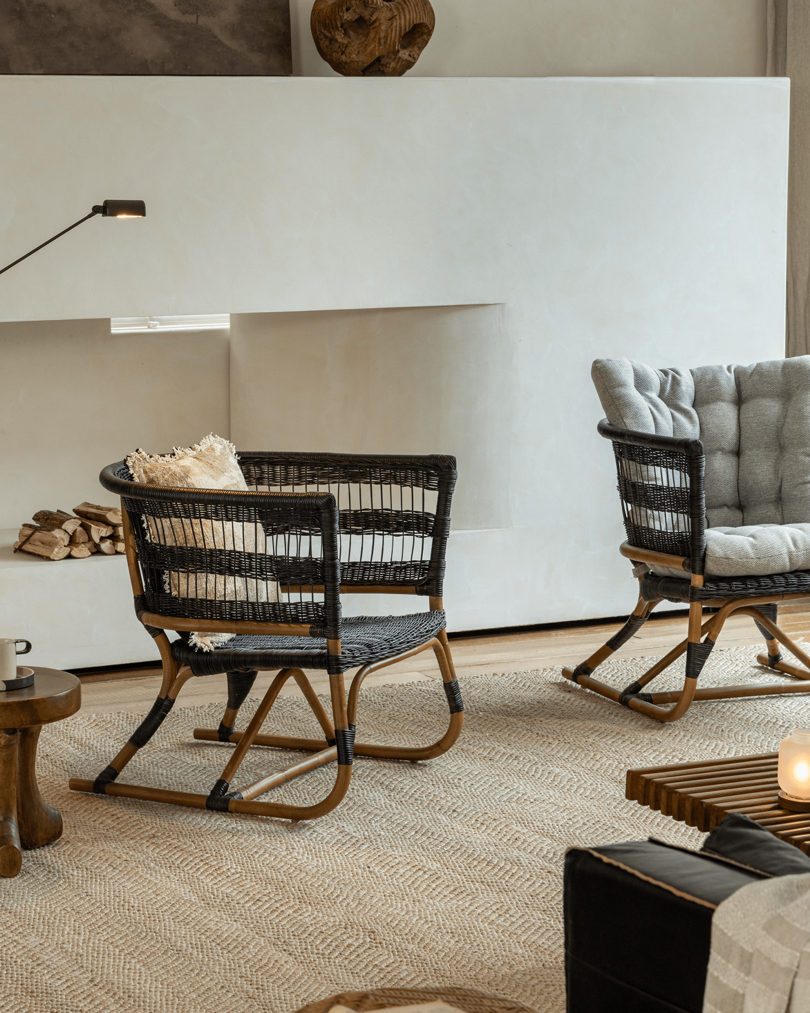 Helian Rattan Chair with black rattan frame and gray cushion, modern interior design
