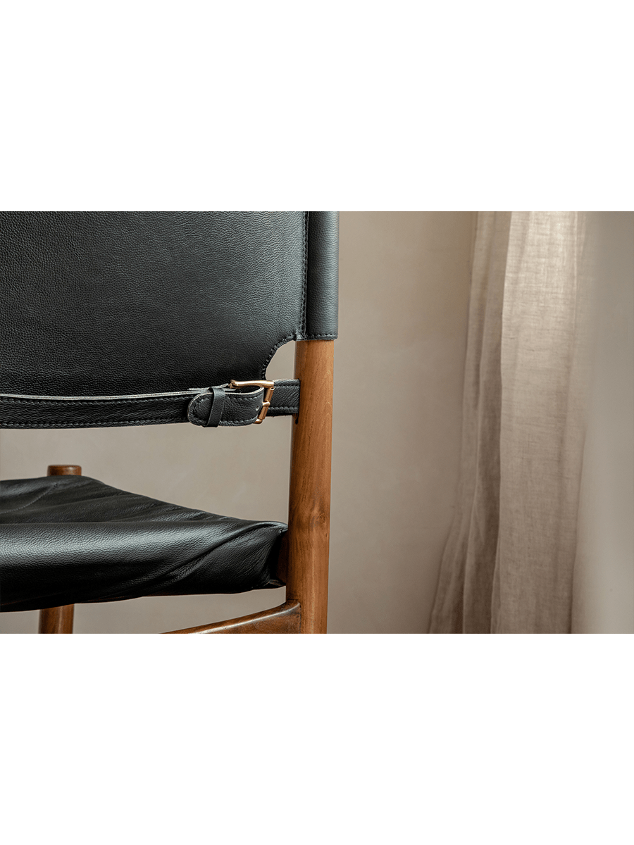 Spanish Dining Chair detail: Black leather seat and back, teak wood frame with adjustable buckle, durable design