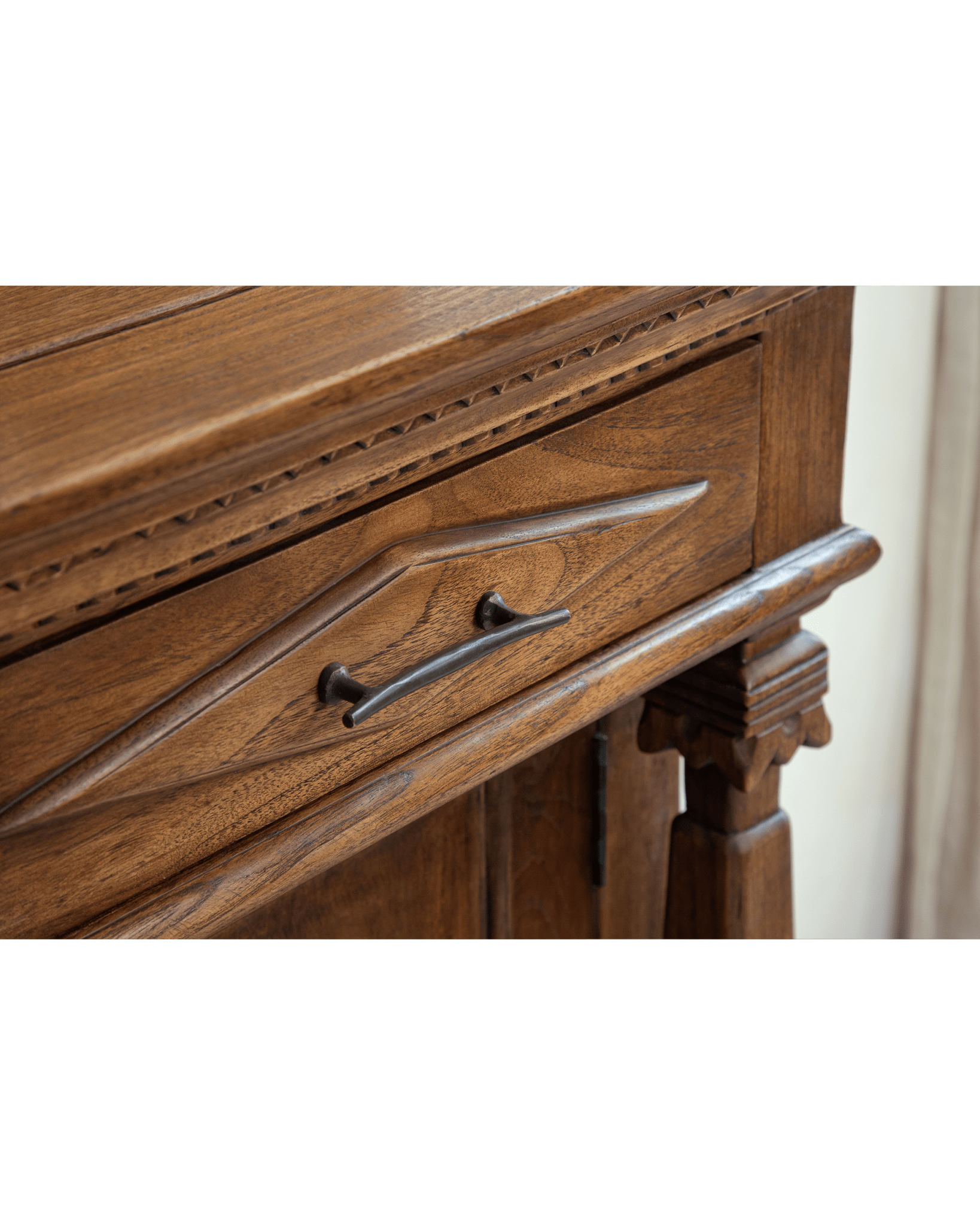 Victoria Teak Cabinet drawer with antique brass handle, detailed carvings, and teak wood grain.