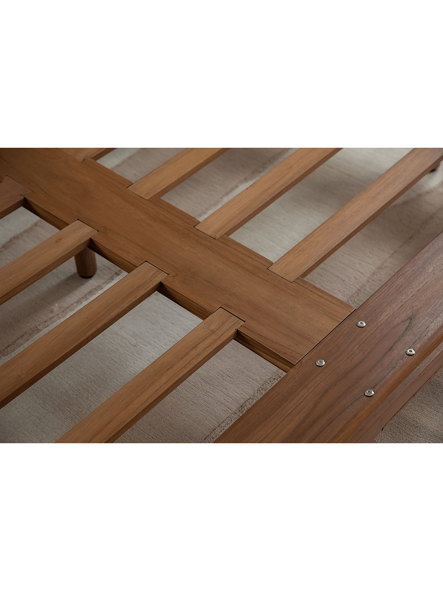 Seren Teak Linen Bed detail: Solid teak wood frame construction, showcasing joinery and wood grain.