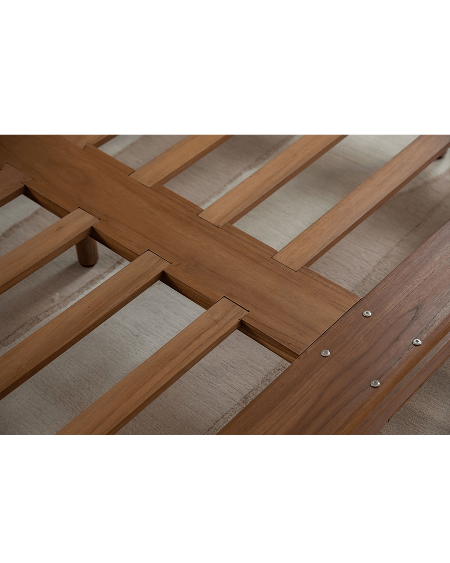 Seren Teak Linen Bed detail: Solid teak wood frame construction, showcasing joinery and wood grain.