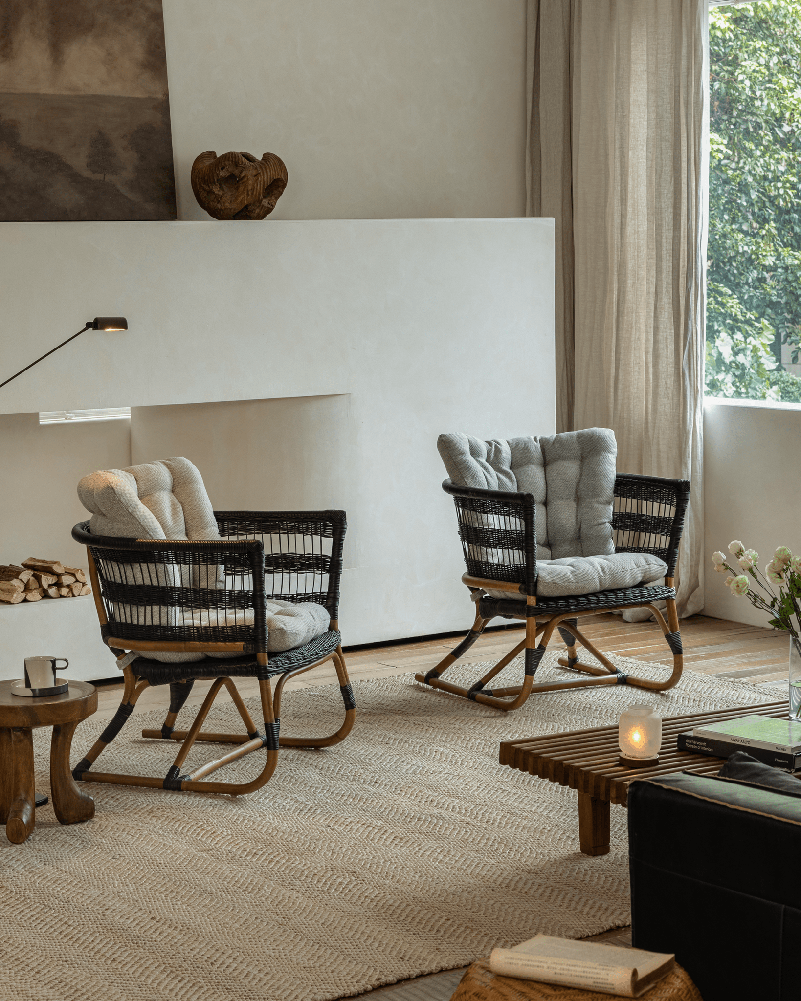 Helian Rattan Chairs in a cozy interior, black frame and gray cushions, stylish design