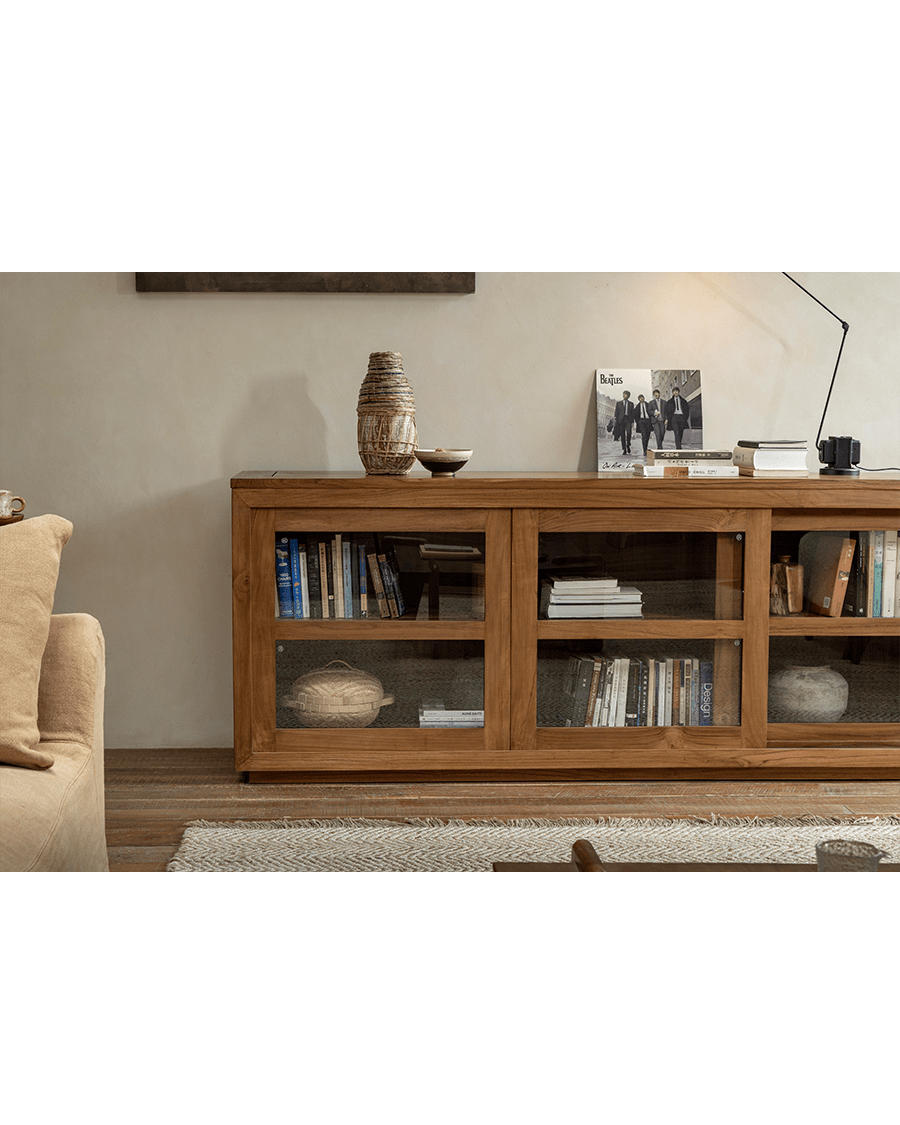 Teak wood glass front bookcase with sliding doors, stylish living room display, perfect for books and decor storage.