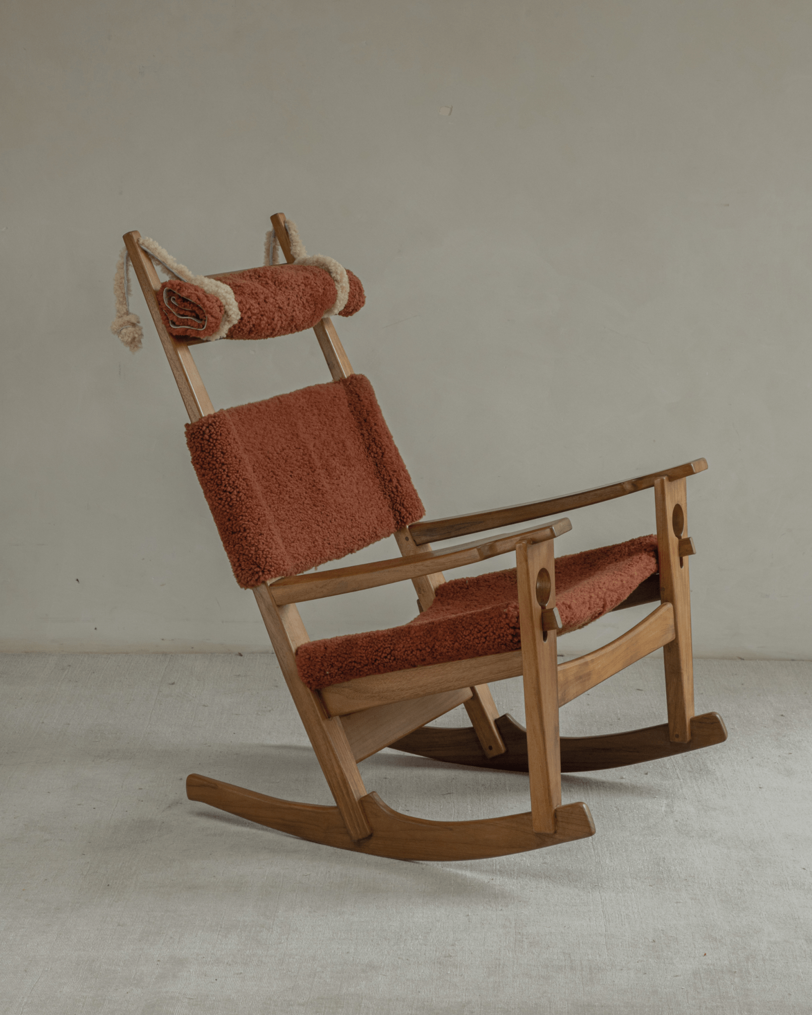 Hans Rocking Chair with terracotta lambswool upholstery and solid teak frame, Danish design.