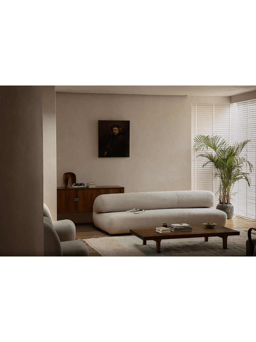 Cream Wave Bouclé Sofa in cozy living room with bouclé fabric and wave design, wooden accents
