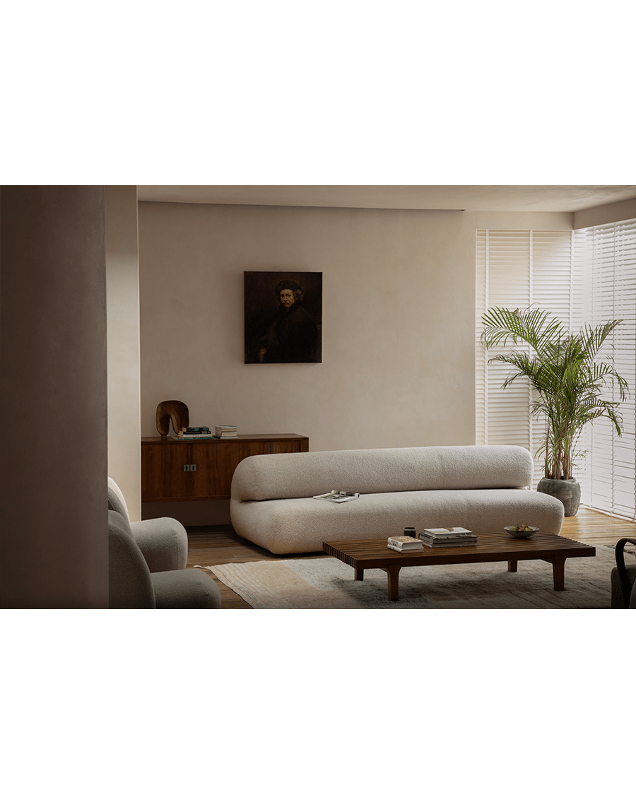 Cream Wave Bouclé Sofa in cozy living room with bouclé fabric and wave design, wooden accents