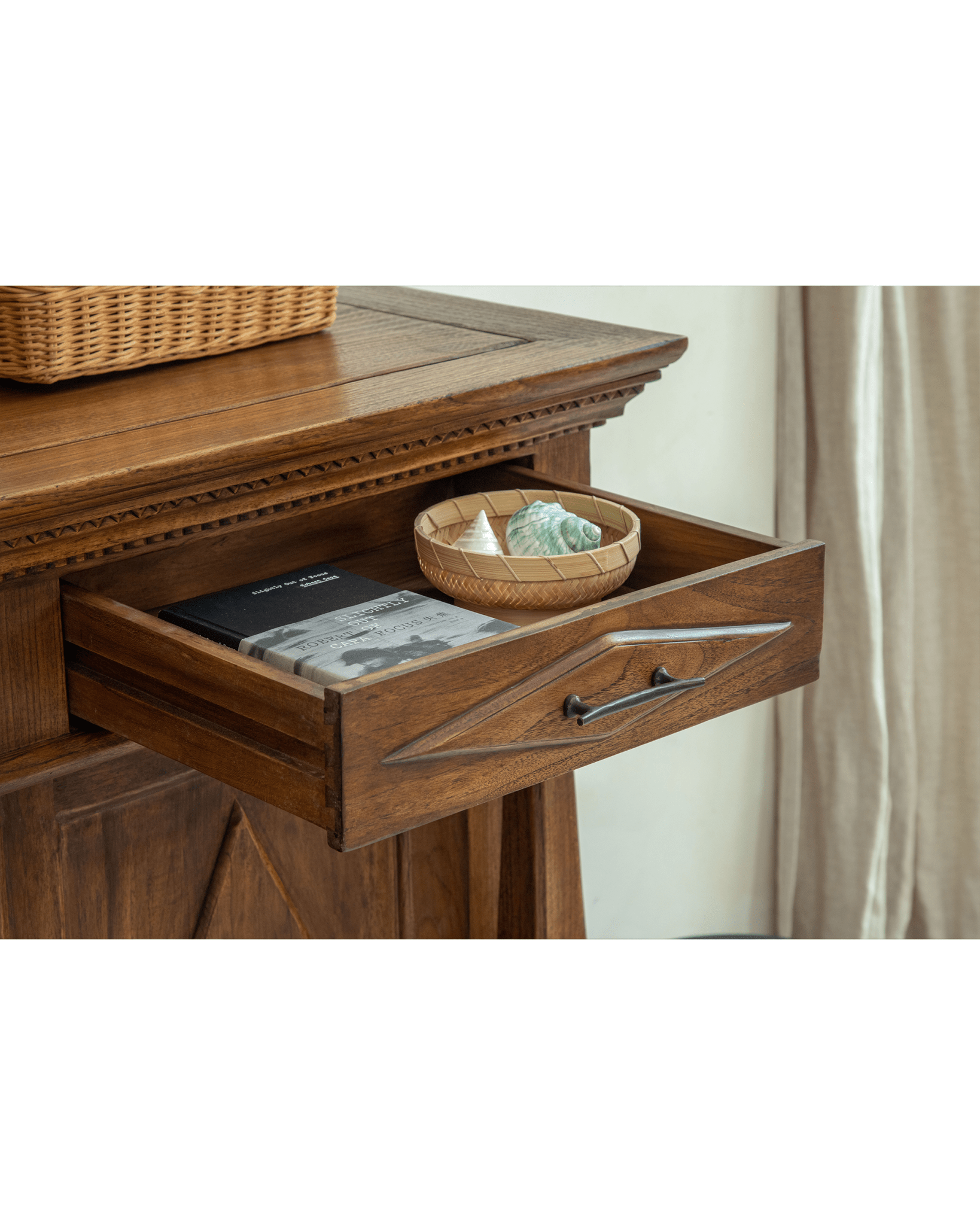 Victoria Teak Cabinet open drawer with teak wood detail, antique handle, books & shells.