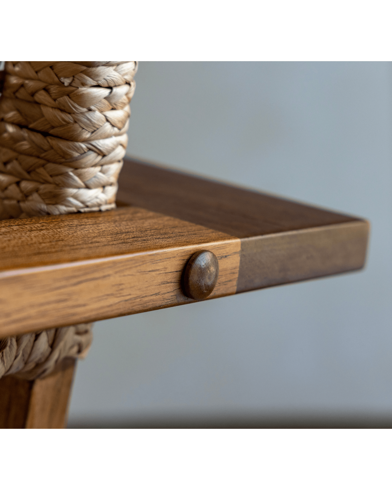 C Curve Lounge Chair detail: Bentwood armrest with woven grass rope seat and wooden peg. Mid-century modern design.