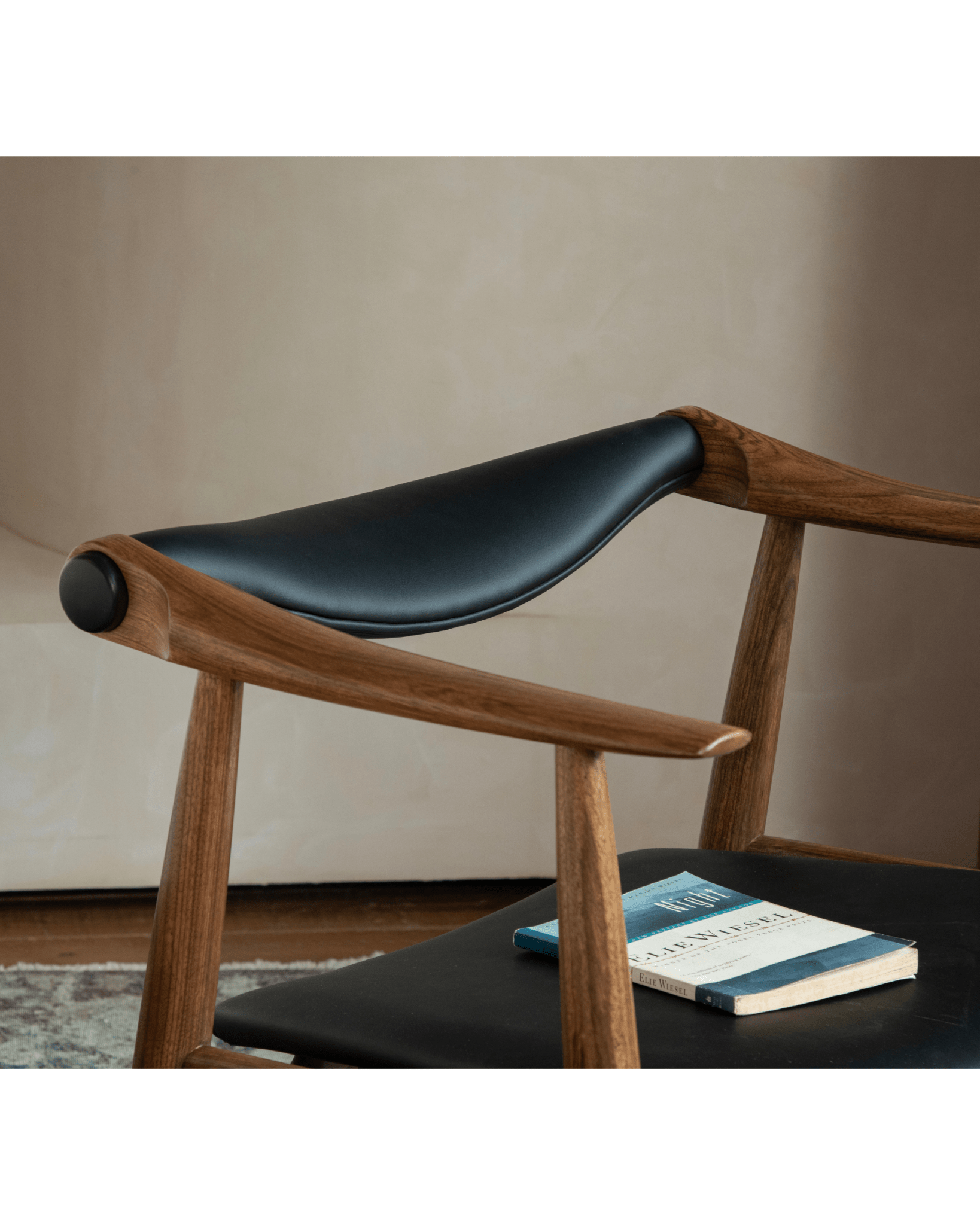 CH34 Yoke Chair: Ebony wood and black leather detail, book 'Night', mid-century modern design