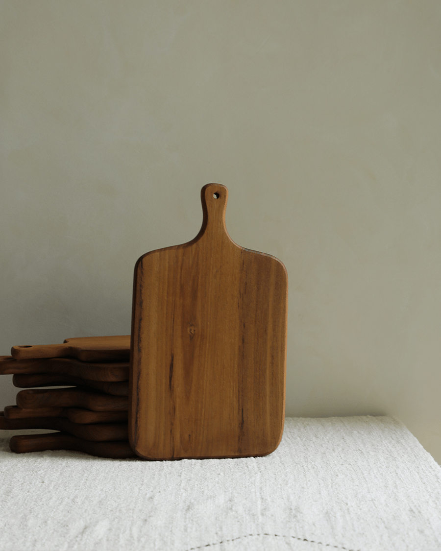 Teak cutting board with handle, handcrafted kitchen essential