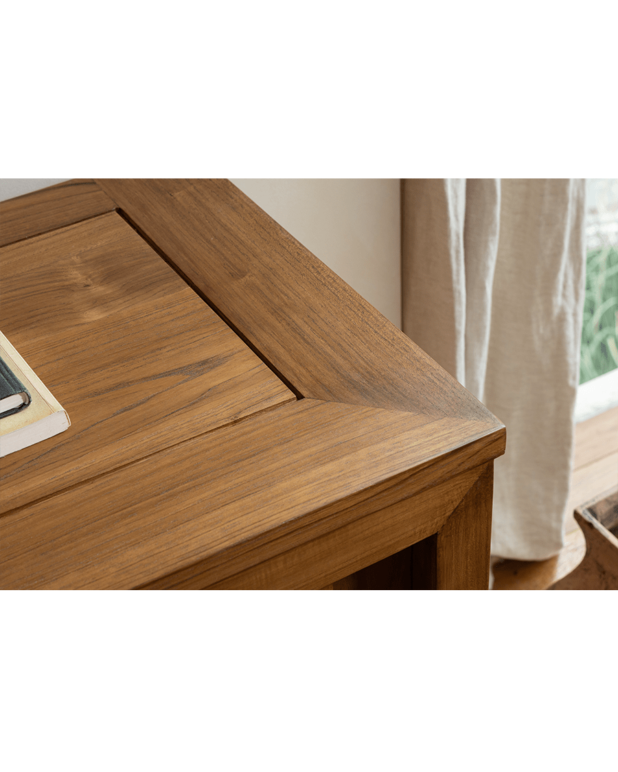 Teak wood bookcase corner detail. Showing the wood grain and craftsmanship of the glass front bookcase.