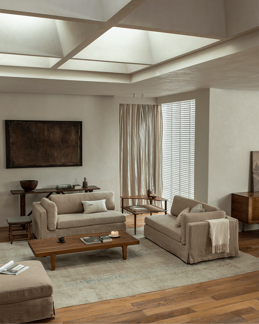 Beige linen Skirt Sectional Sofa with skirted base in a modern living room setting.