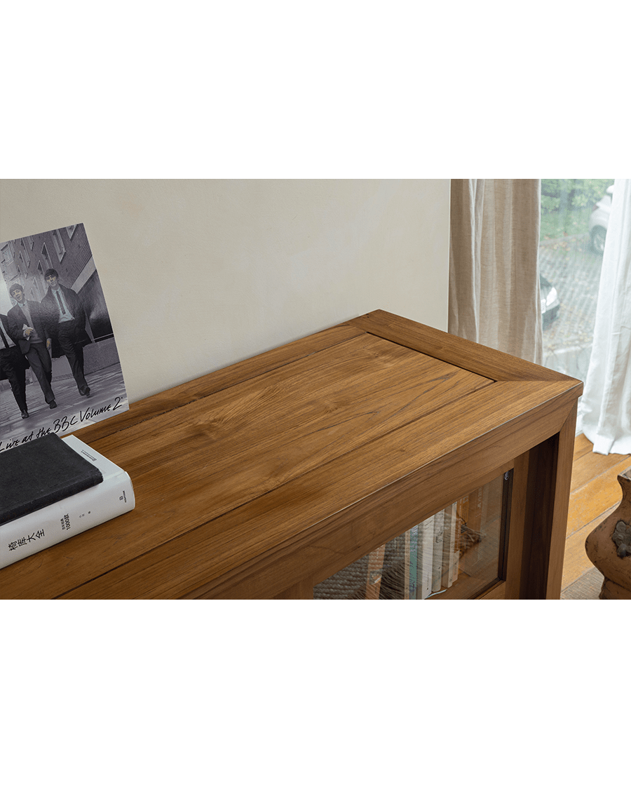 Teak wood Glass Front Bookcase close-up, highlighting wood grain and design, perfect for display.