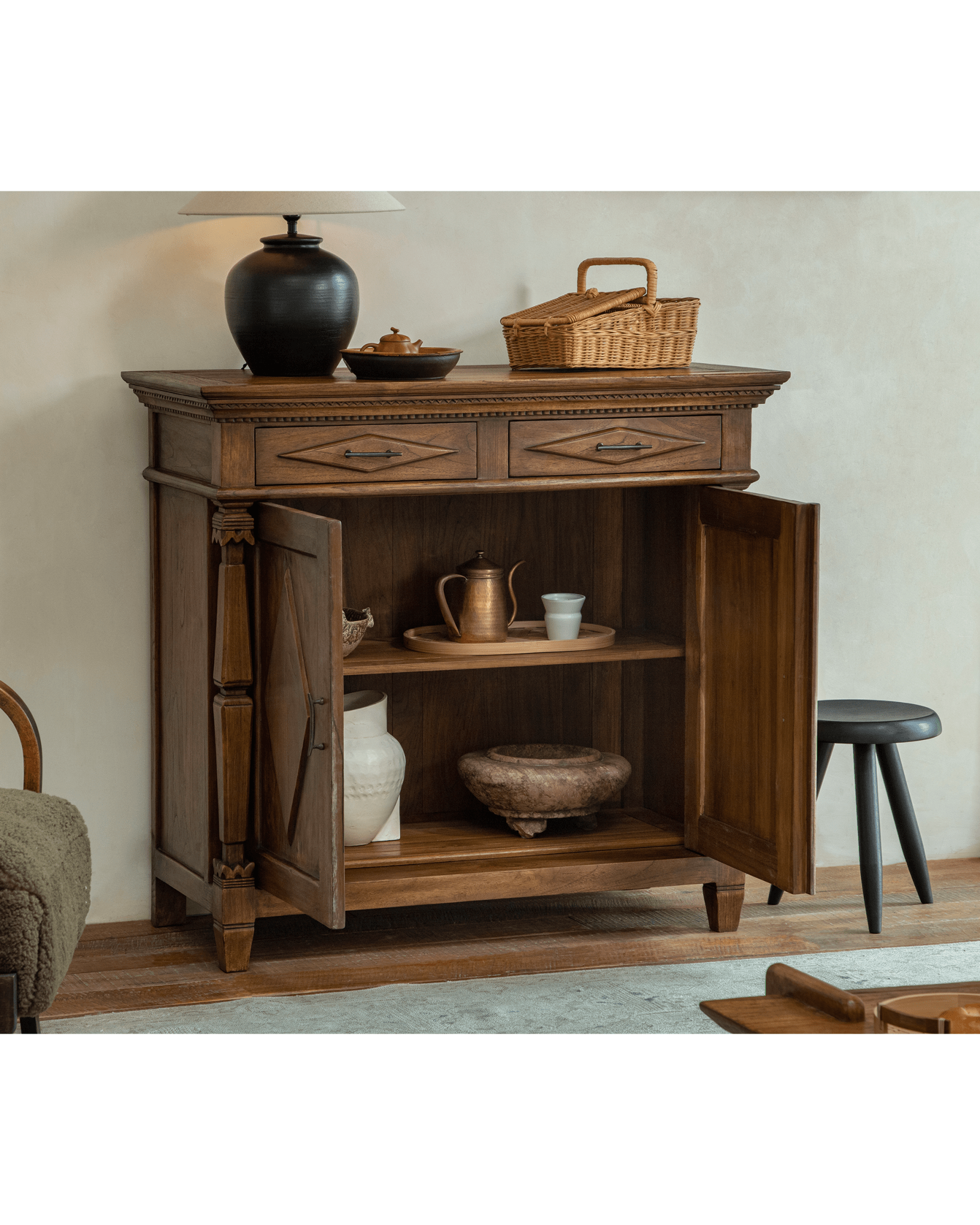 Solid teak Victoria cabinet with intricate carvings, Roman columns, brass handles, vintage finish.