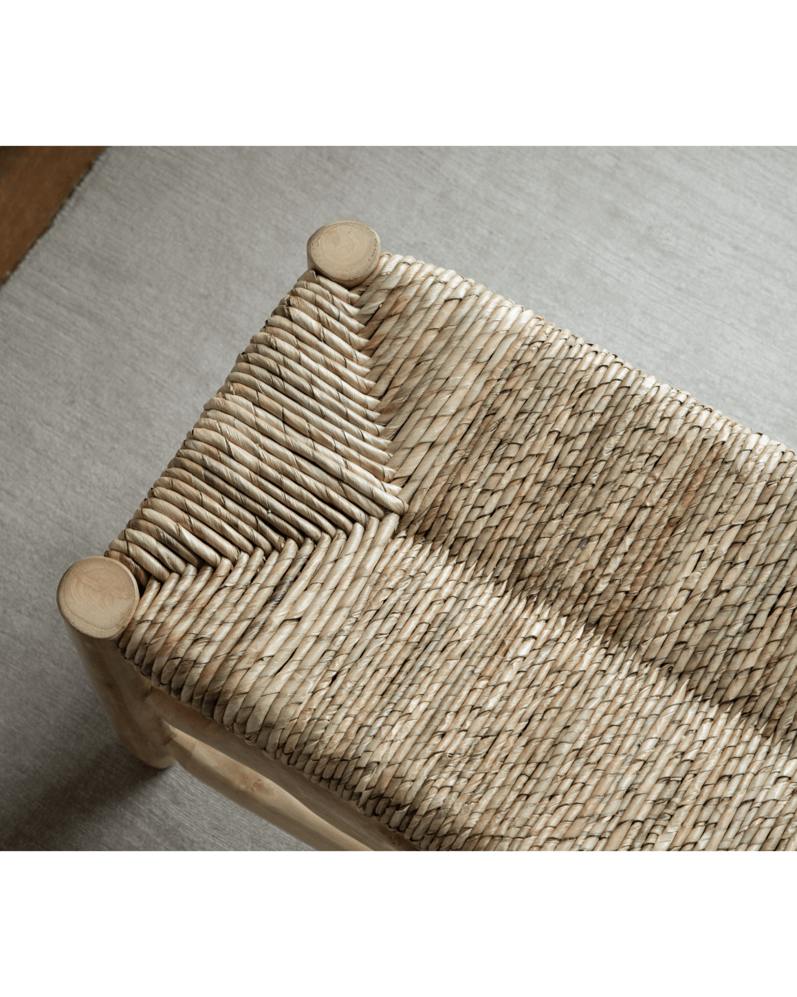 Isla Bench close-up: Woven pandan leaf seat with teak frame, modern organic design