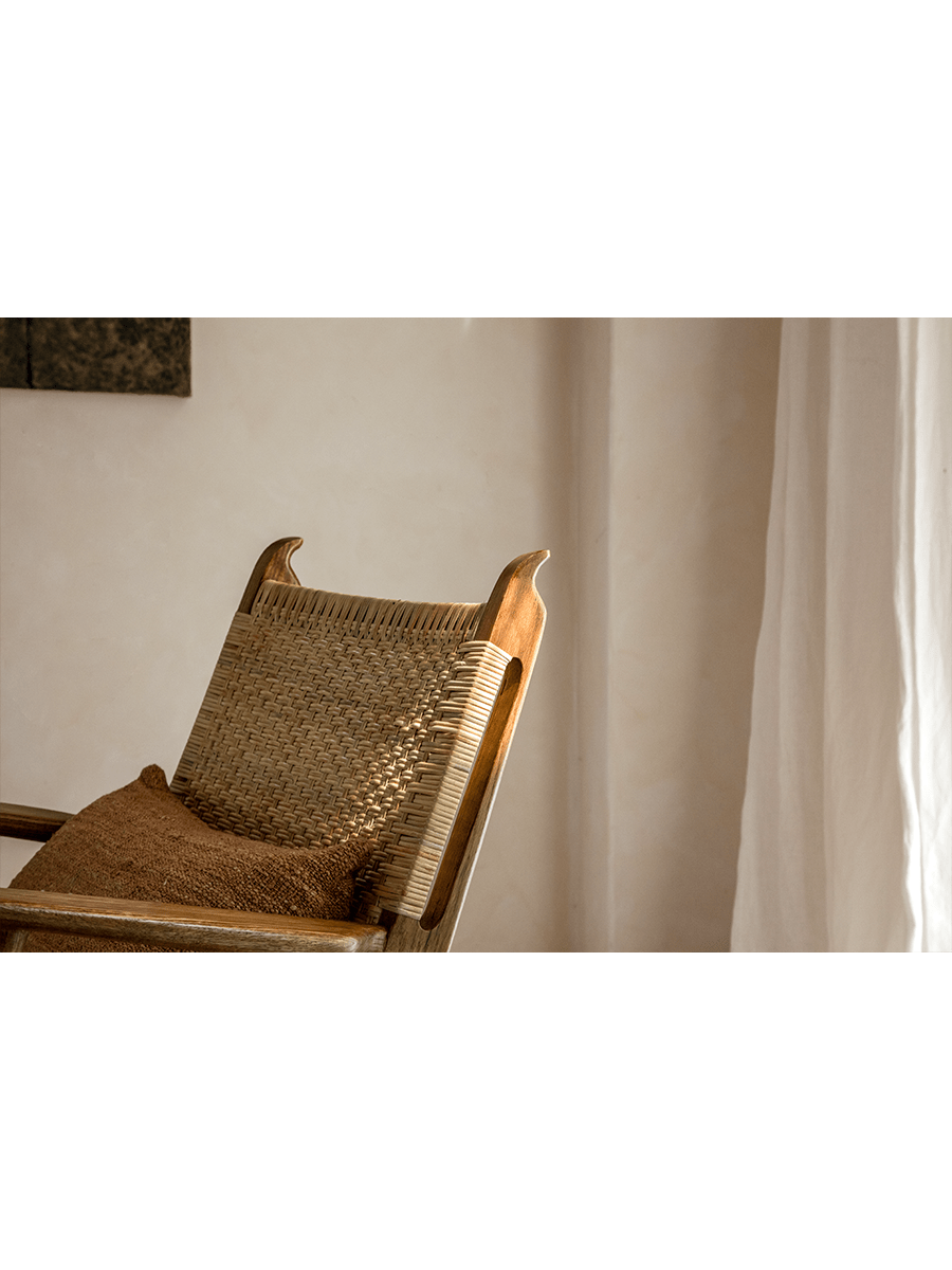 Horn Lounge Chair: Oak frame and natural rattan backrest with cushion, ergonomic design