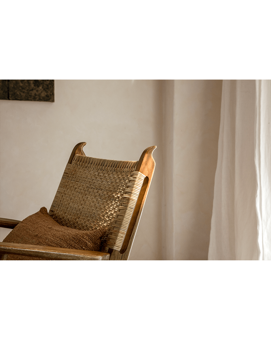 Horn Lounge Chair: Oak frame and natural rattan backrest with cushion, ergonomic design