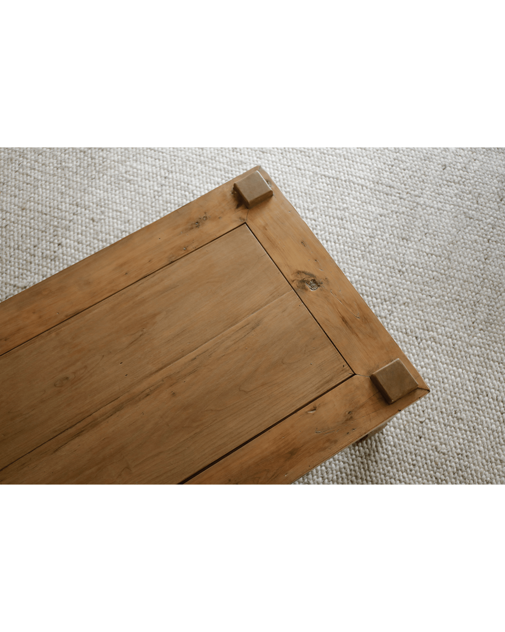 Keoni Coffee Table detail, rustic reclaimed wood with square corner design and natural finish on off-white rug