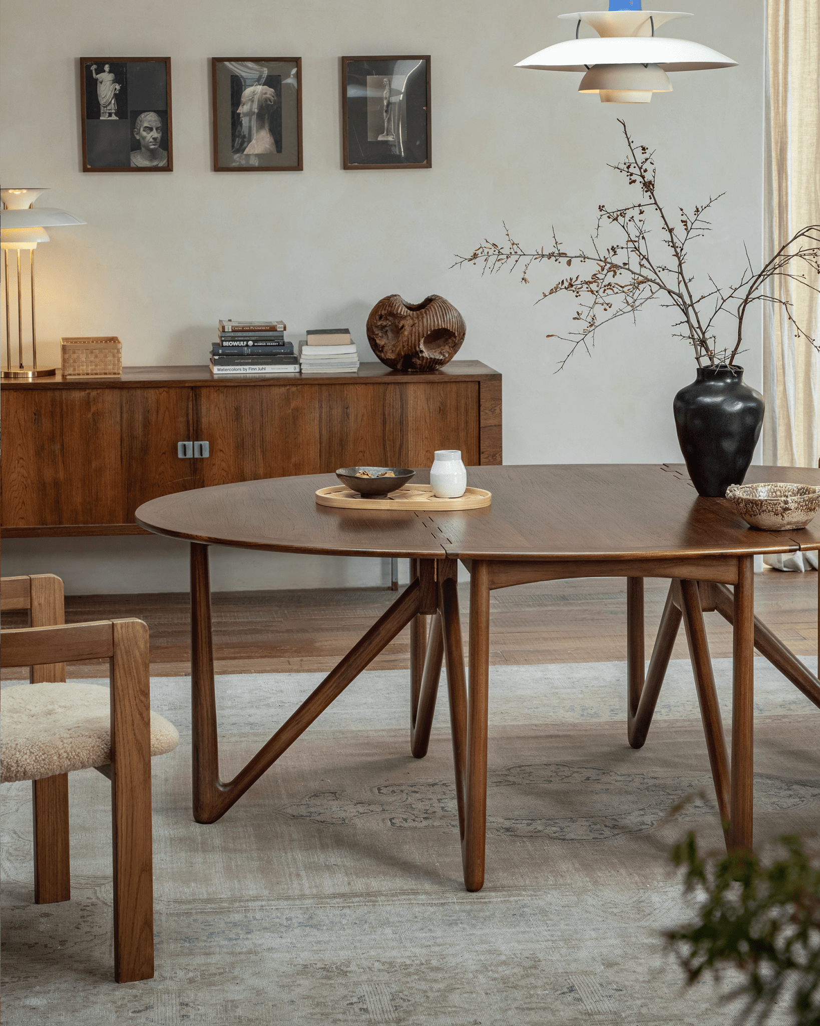 Niels Folding Table extended in use, teak wood with V-shaped legs, mid-century modern dining setting