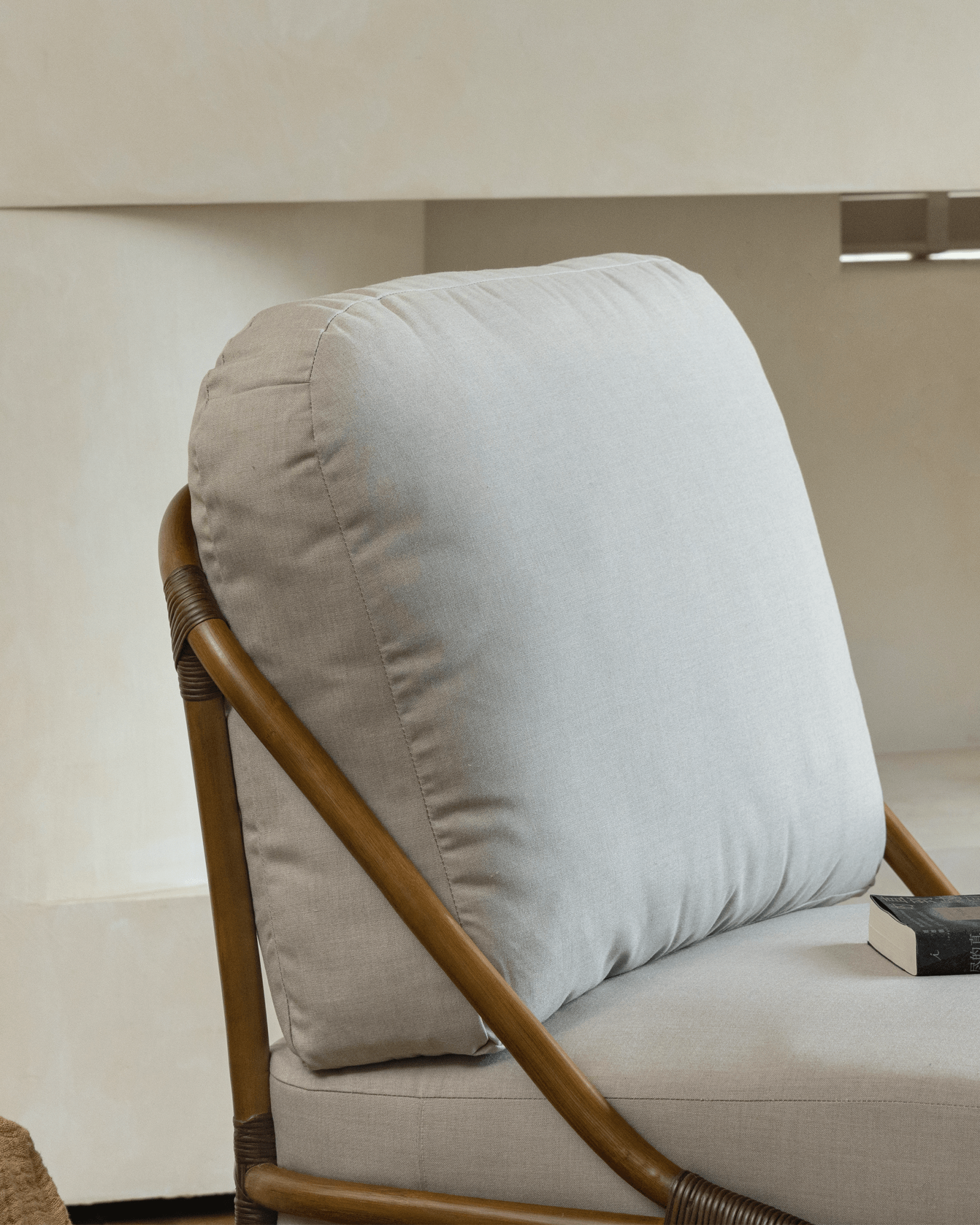 Tofu Lounge Sofa: Rattan frame and light gray cushion. Promoting relaxed and comfortable seating.