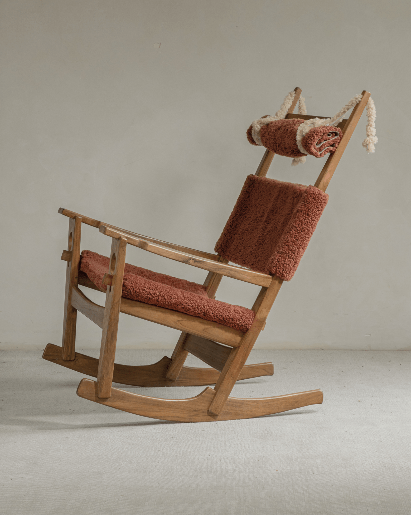 Hans Rocking Chair with teak frame and rust shearling upholstery. Danish design.