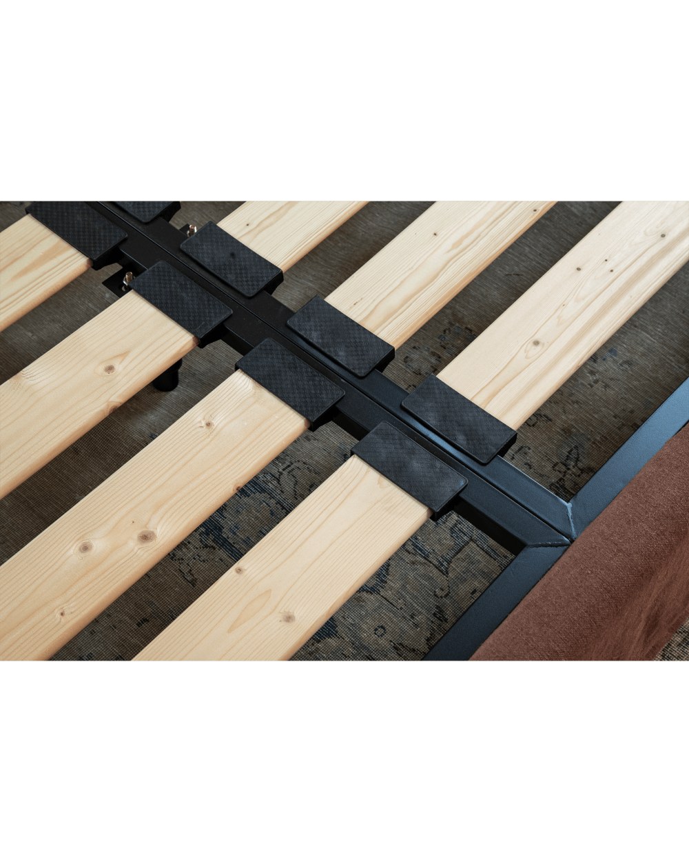 Freya Linen Bed frame detail, solid pine frame, and terracotta linen upholstery for peaceful sleep.