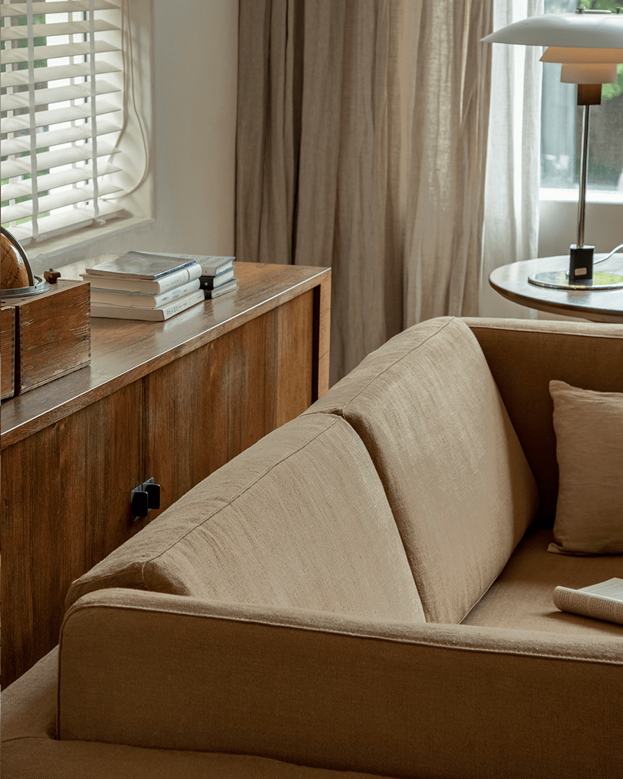 Beige Skirt Linen Sofa in a modern living room, linen fabric and wooden furniture, create a peaceful atmosphere