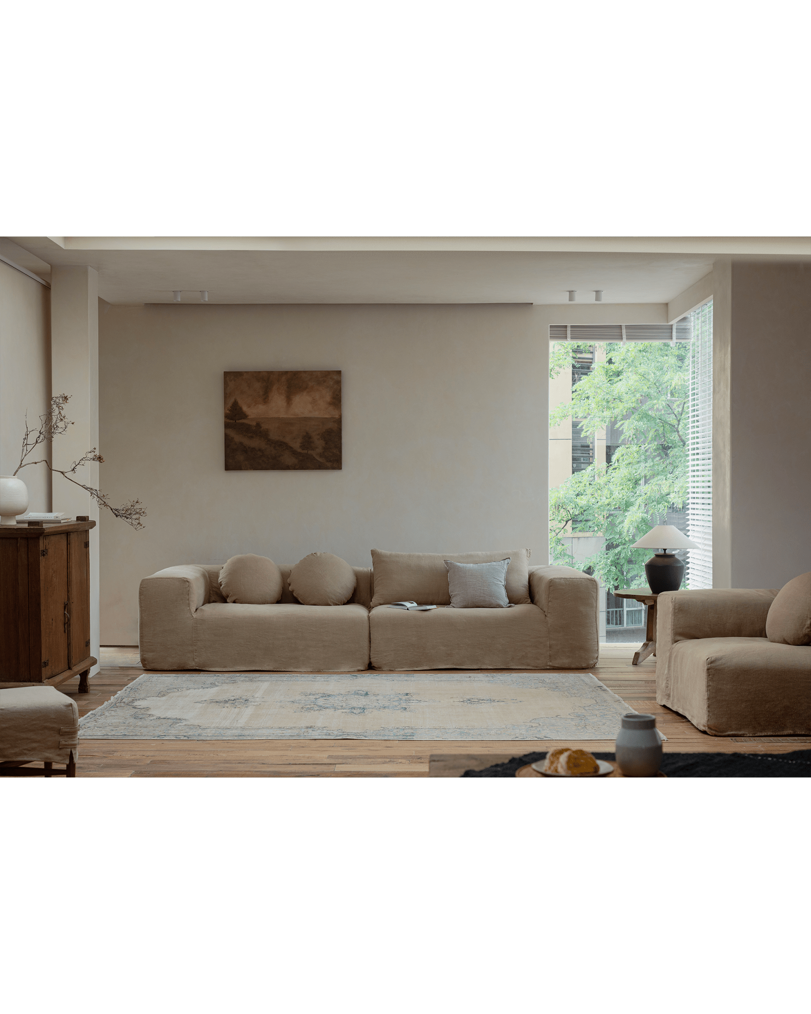 Doma Sectional Sofa in beige linen, bright living room, modular design, relaxed aesthetic