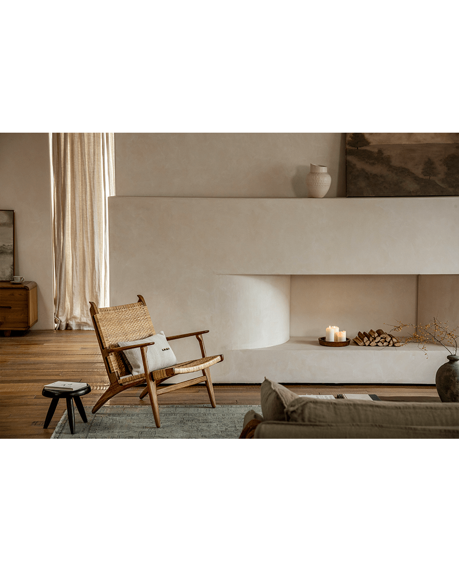 Horn Lounge Chair in interior setting, oak frame, natural rattan seat, ergonomic design, enhancing interior decor