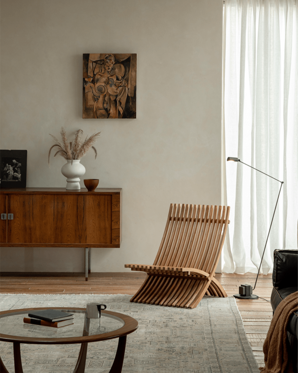 Oly Lounge Chair in modern interior setting. Wooden slatted design, ergonomic and stylish seating.