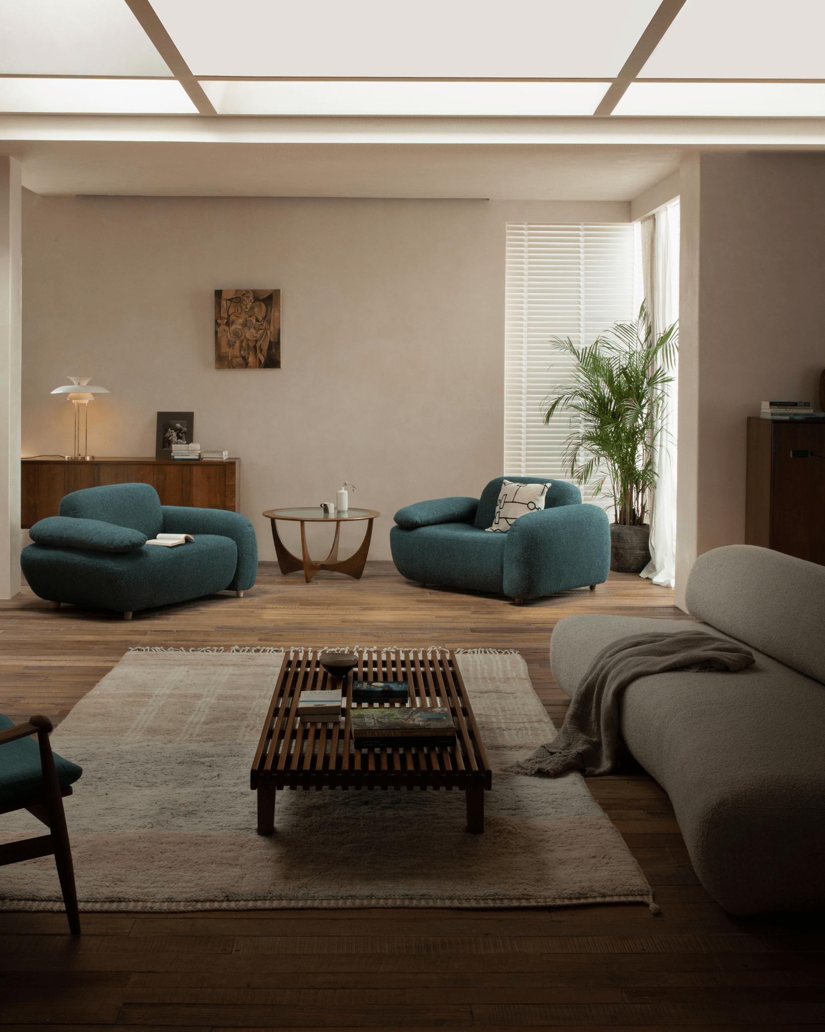 ZM Daybed Coffee Table featured in a modern living room with teak wood and minimalist design.