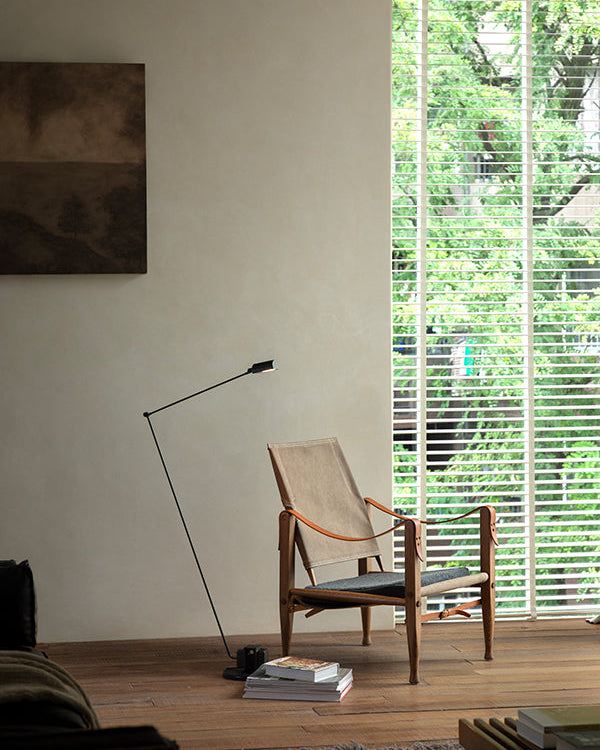 Safari Chair in a stylish living room setting, featuring wood, leather, and canvas materials