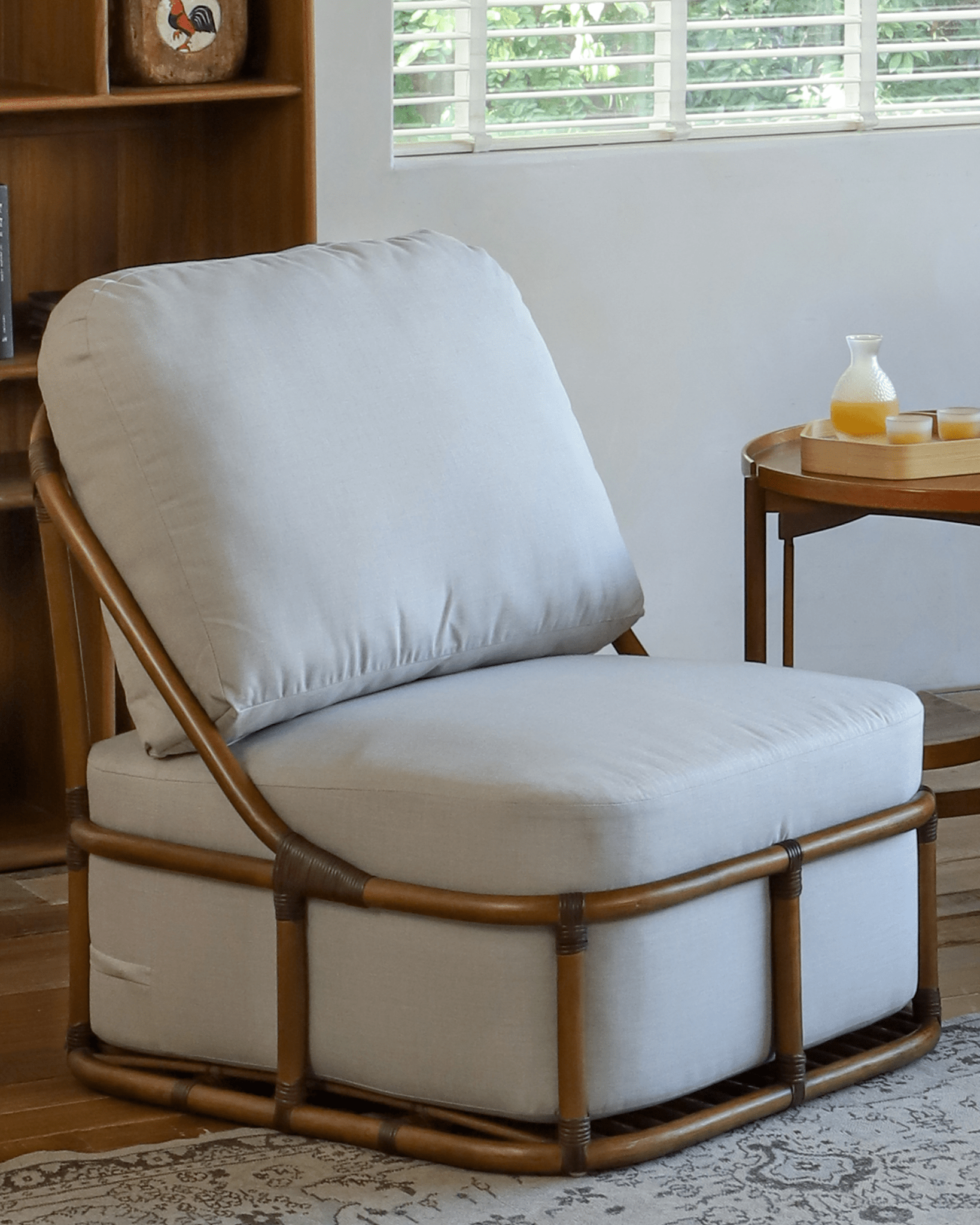 Tofu Lounge Sofa chair with rattan frame and light gray cushion, comfortable seating for relaxation