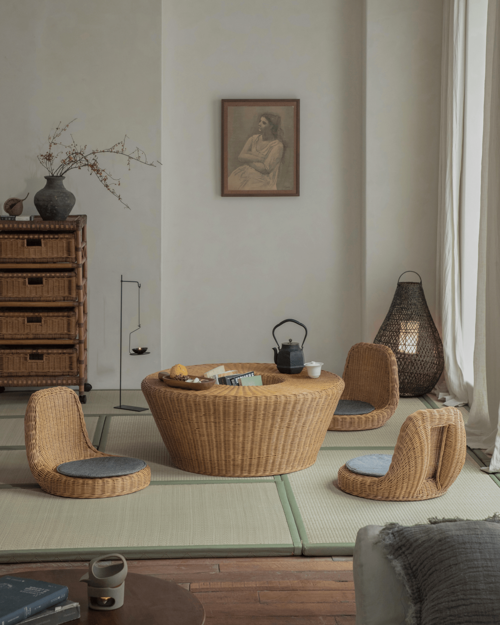 Nest Coffee Table in a relaxed living room setting, showcasing rattan design and sunken storage