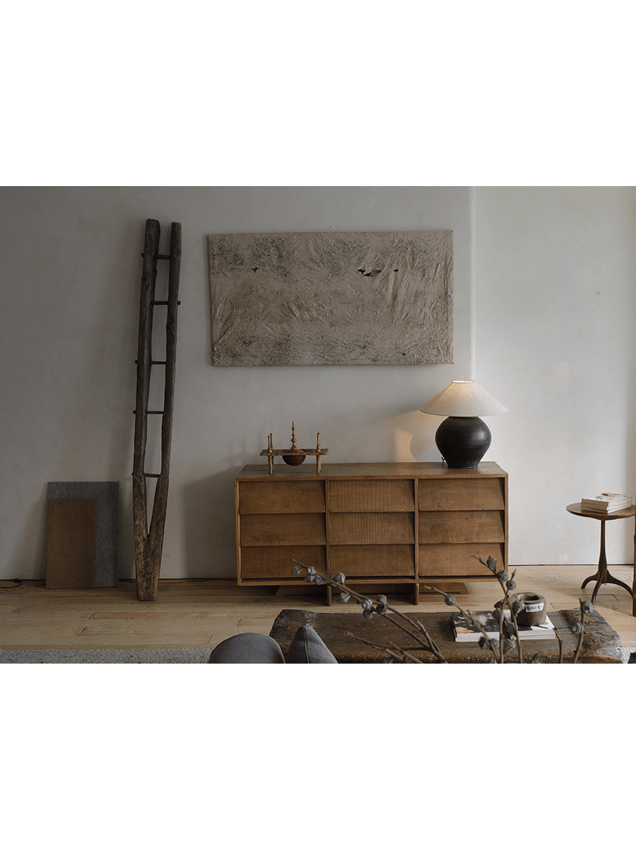 NO.9 Sideboard: Reclaimed wood sideboard with nine handleless drawers in a minimalist living room setting.